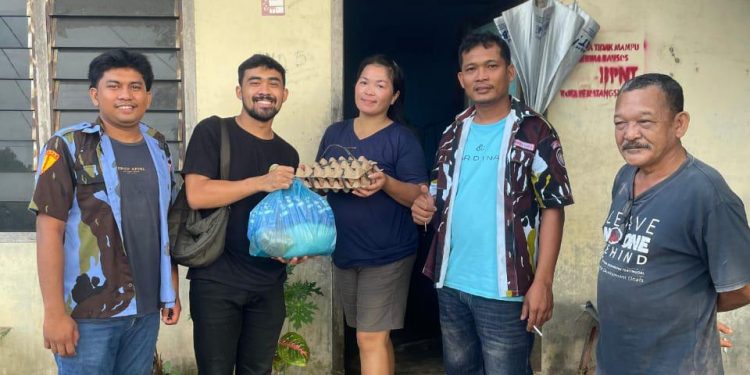 Sambut Natal Dan Tahun Baru, Koin Bar & KTV Saluran Bingkisan Kepada Warga